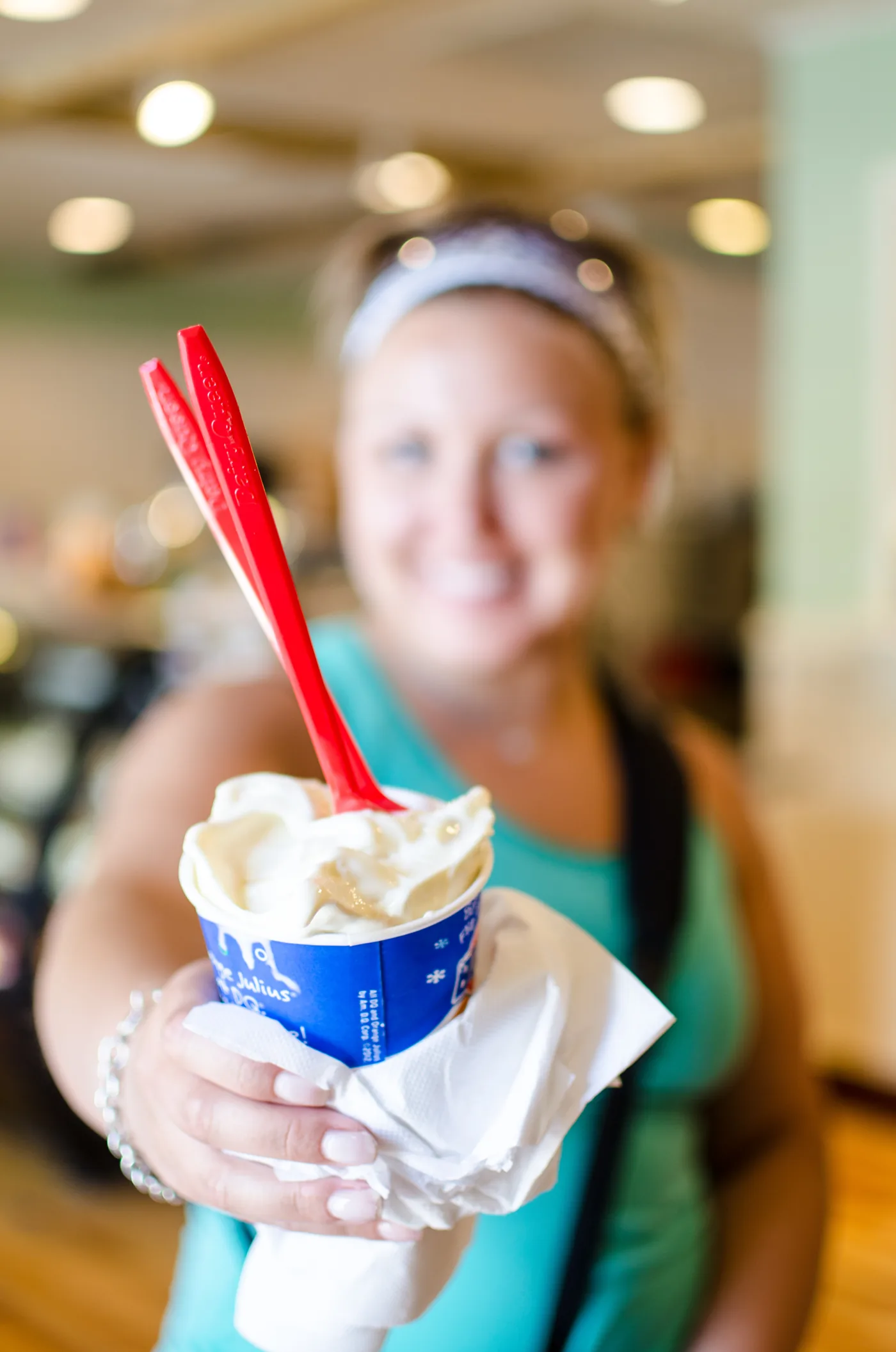 Customer holding a Dairy Queen Blizzard Treat with the red spoon